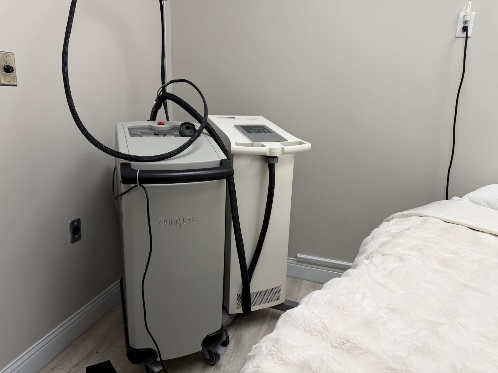 Cynosure Elite+ laser hair removal system with its skin cooling unit at Elegancy Beauty Bar in Ajax