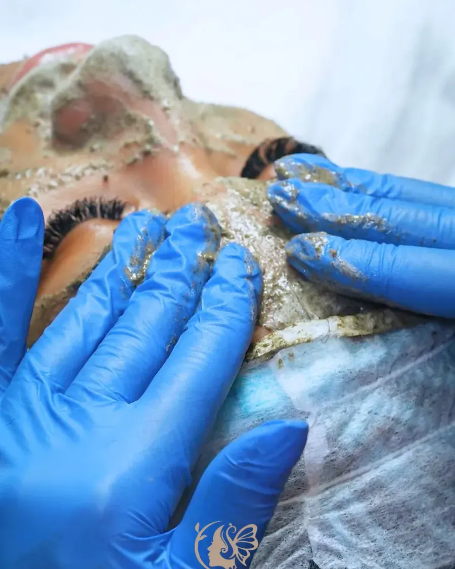 Herbal peel being massaged into the skin at Elegancy Beauty Bar in Ajax